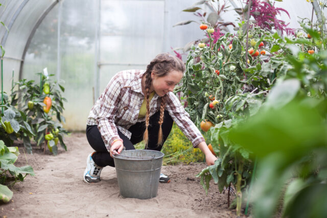 teenage girl in greenhouse