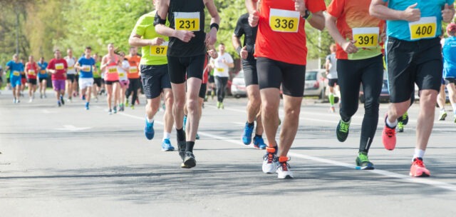 Marathon, street runners in spring day