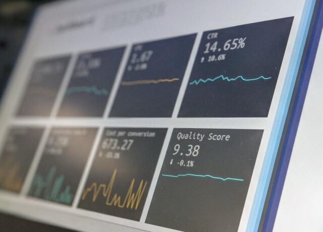 A computer displays various data metrics for a company to analyze.